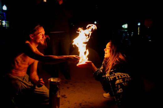 Fire bubble experience: a guest holding a burning fire bubble in her palm