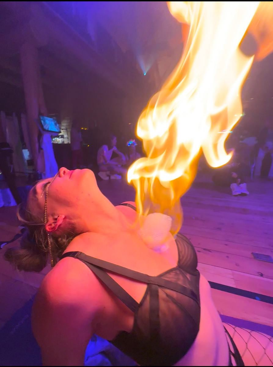 Internal Ignition ceremony: a fire bubble rising from a woman's heart as she leans back